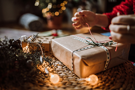 Woman wrapping a holiday gift