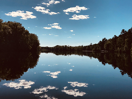 Lake with reflections on clear day