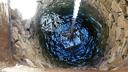 Iron bucket with water well