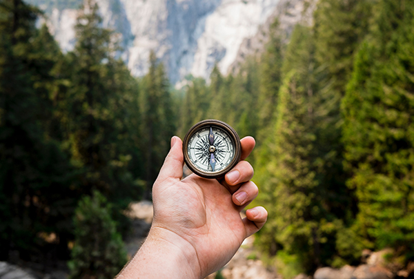 Reading a compass in the woods