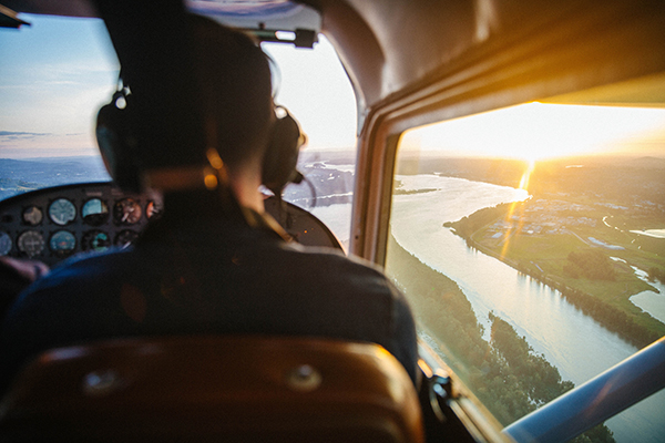 Conservation pilot flying over land