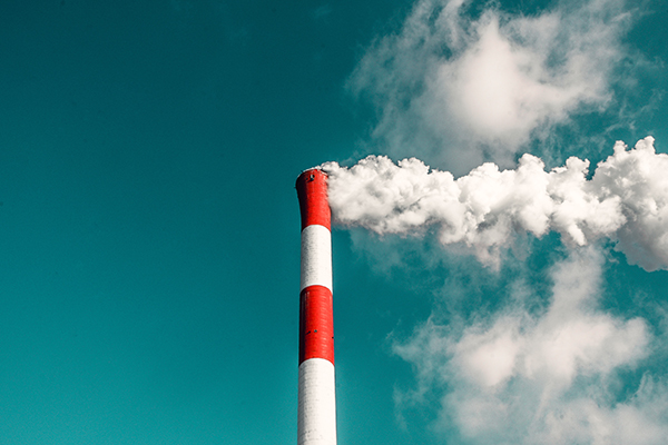 Photo of white smoke from Smokestack Credit: Photo by veeterzy on Unsplash