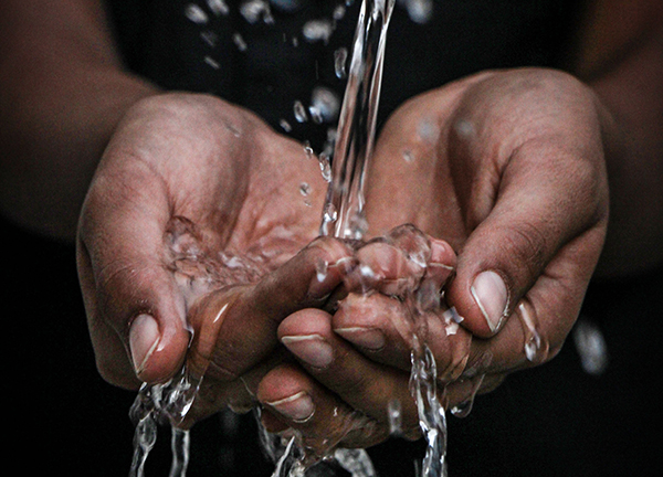 Hands out catching water