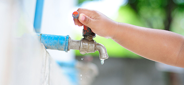 Child turning off water