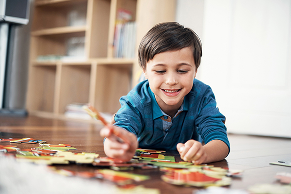 Kid Working on Puzzle