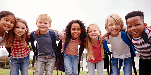 A group of kids smiling and having fun